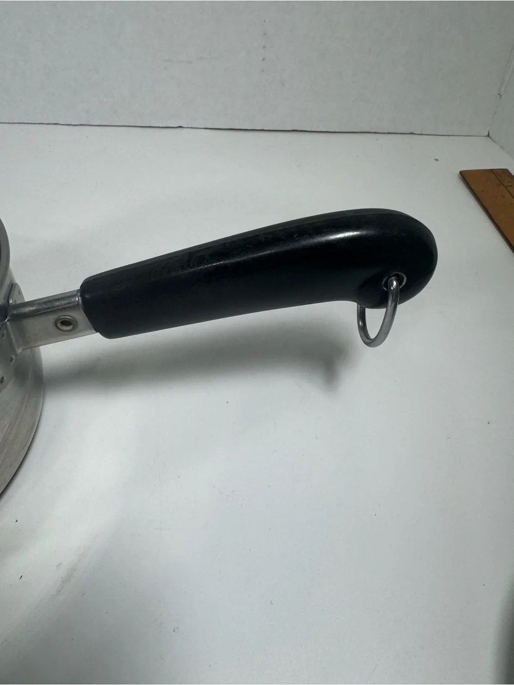 Stainless Steel Saucepan with Black Handle and Lid